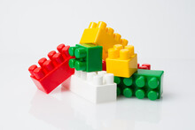 Many Multi-colored Cubes Of Blocks Of Children's Constructor On A White Background