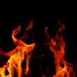 © Andrii Zastrozhnov - Fiery flame with sparks on a black background. Texture (element) for barbecue or cooking.