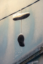 Old Shoes Hanging On A Wire