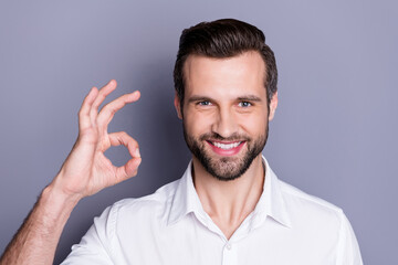 Poster - Portrait of positive cheerful confident man attorney investor economist enjoy excellent great ads promo show okay sign wear good look clothes isolated over gray color background