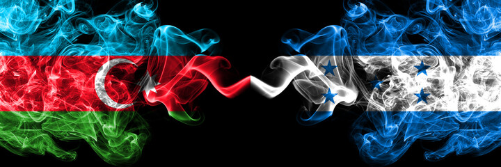 Azerbaijan, Azerbaijani vs Honduras, Honduran smoky mystic flags placed side by side. Thick colored silky abstract smoke flags