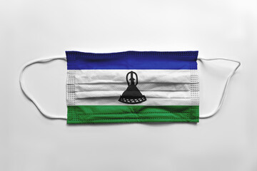 Canvas Print - Face mask with Lesotho flag printed, on white background, isolated