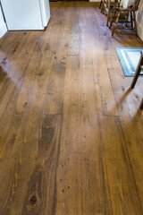 Old wood stained floor of hunting fishing cabin in rural Georgia