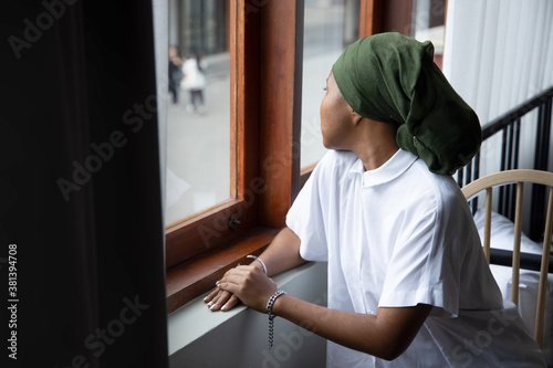 Cuadros en Lienzo Portrait of sad African young woman cancer patient fighting with the sickness, w