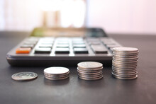 Stack Money Thai Bath Coin For Growing Business And Calculator On The Table. Concept Of Finance And Business.