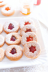 Wall Mural - Traditional christmas linzer cookies on a white dish, selective focus