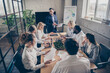 © deagreez - Photo of business people sharks gathering sit table desk listen investor talk company growth way-out crisis strategy in workplace workstation