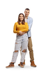 Wall Mural - Full length portrait of a young man embraceing a young woman from behind