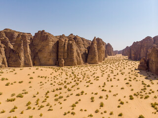 Canvas Print - Sand dunes and rock formations in Al Ragassat canyon trail in Al Ula, western Saudi Arabia