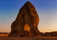 Elephant Rock Natural Geological Formation With Unidentified Tourists At The Base Looking Up, Al Ula, Western Saudi Arabia 