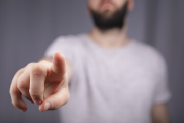 Poster - touching finger press young man