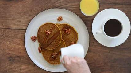 Canvas Print - Pouring Syrup over Pumpkin Pecan Pancakes 