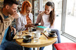 © BalanceFormCreative - Group of university students hangout in college cafe library and preparing for lecture.