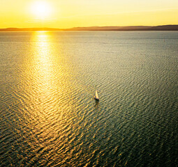 Sailboat in the sunset at lake Balaton, Hungary