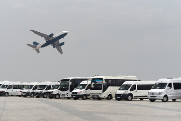 Wall Mural - Airport passenger service transfers on minibuses and buses