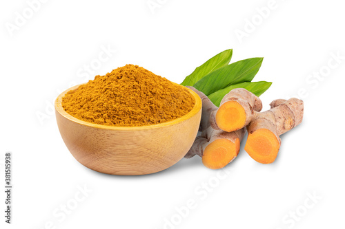 Fotografía Turmeric powder (curcuma longa linn) in wooden bowl with root and leaves isolated on white background