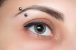 Eyebrow piercing. Eyelash tattoo. Cosmetic procedures.