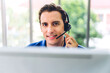 © Art_Photo - Happy call center smiling businessman operator customer support consult phone services agen working with wireless headset microphone and computer at call center office