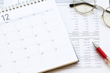 financial statement for check with calendar for business work of personal arrangement flat lay style at office desk