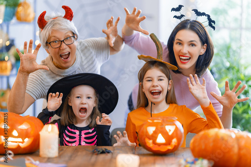 Fototapeta family celebrating Halloween