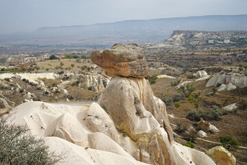 Wall Mural - Three graces (Beauties) natural rock formations known as fairy chimneys created by erosion of the rock into strange shapes located on Urgüp, district of Nevsehir- Cappadocia Goreme valley, Turkey