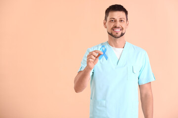 Poster - Doctor with blue ribbon on color background. Diabetes awareness concept