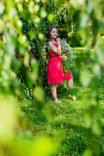 Happy Small Baby Girl Wear Red Dress Holding Summer Flowers On Natural Landscape, Nature