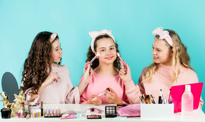 Happy girls doing makeup together. Sisterhood happiness. Cosmetics shop. Apply powder. Cream base tone. Prevent acne. Kids makeup. Skin care concept. Cosmetics for children. Beauty and fashion