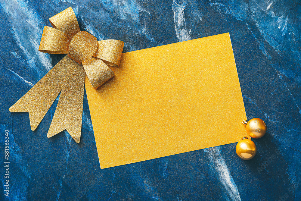 Beautiful Christmas decorations with empty card on color background