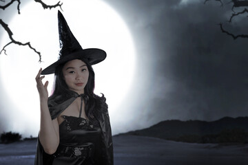 Poster - Asian witch woman with a hat standing