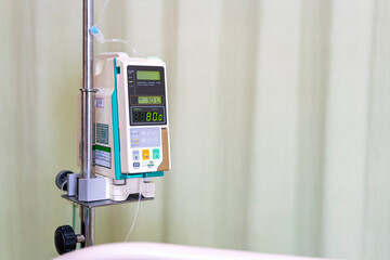 Modern automatic Infusion pump for control infuses fluids medication or nutrients sodium chloride saline solution fluid iv drip with copy space