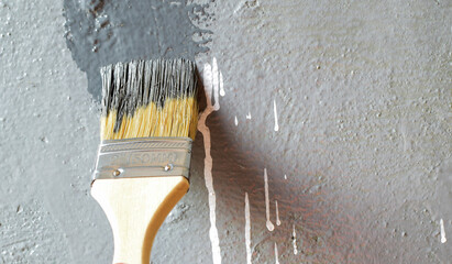 Painting an old wall with paint, painting tools. Place for text