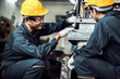 © totojang1977 - Team of Asian engineer mechanic man checking and using wrench for maintenance pressing metal machine at factory, worker at industrial working concept