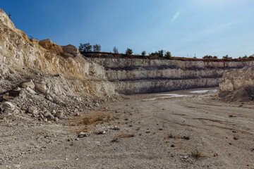 Wall Mural - Inside open chalky quarry pit in autumn