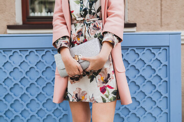 Wall Mural - close up purse of attractive stylish woman walking city street in pink coat spring fashion trend