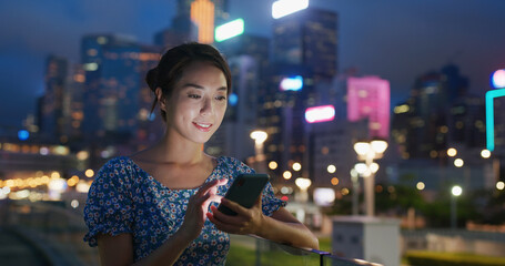 Canvas Print - Woman use cellphone for online at night