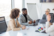 © Sanja - A group of business partners is sitting in a conference room, business partners have new business ideas