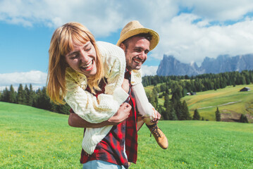 happy couple on vacation on the dolomites mountains