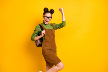 Wall Mural - Portrait of her she nice attractive cheerful lucky intelligent girl nerd geek celebrating back to school 1 September day isolated bright vivid shine vibrant yellow color background