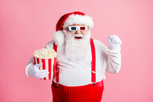 Portrait Of His He Nice Attractive Cheerful Cheery Glad Bearded Fat Santa Watching Comedy Film Eating Corn Having Fun Pastime Amusement Isolated Pink Pastel Color Background