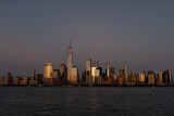 Fototapeta Miasta - Lower Manhattan Skyline right after Sunset along the East River in New York City