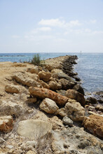 Vertical Shot Of The Rocky Coastline Of Cyprus With Sea View On The Horizon