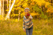 © Olga Soloveva - A boy plays in the autumn Park. The child collects and throws yellow and red leaves. Schoolboy with oak and maple leaves. Fall foliage. High quality photo