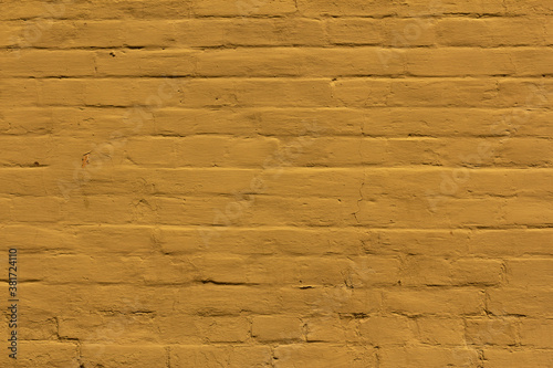 Old yellow stucco brick wall.