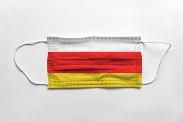 Canvas Print - Face mask with South Ossetia flag printed, on white background, isolated