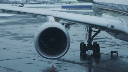 Wall Mural - Cinemagraph - airplane with spinning jet engine front fan. Concept of Travel, transportation, aviation, journey, adventure. Loopable cinemagraph plotagraph effect.