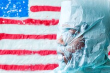 Side View Of Mans Face Covered With Paper Against American Flag