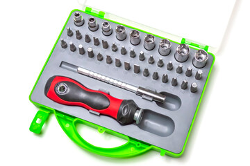 Budget hand tool.Mechanical handle and attachments in the form of heads and screwdrivers.In the package.Close up.