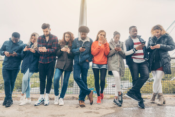 Group of young people staring on their phones