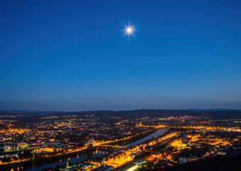 Night shot of the illuminated old German city of Trier, photographed from a hill